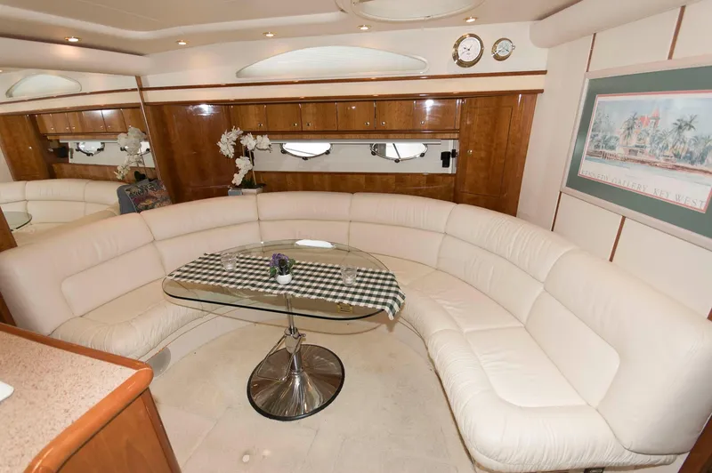 Slide: The Image of Luxurious interior of 2001 Neptunus 56 Express yacht with curved seating and elegant decor. - 27