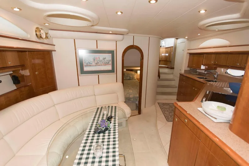 Slide: The Image of Luxurious interior of 2001 Neptunus 56 Express yacht with elegant seating and kitchen area. - 29