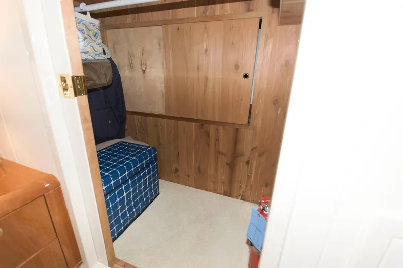 Slide: The Image of Small cabin interior with wood paneling on a 2001 Neptunus 56 Express yacht. - 31