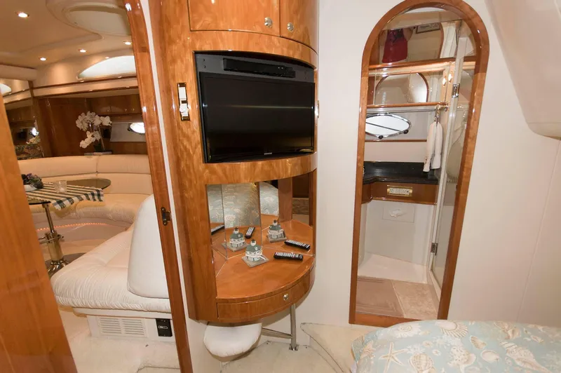 Slide: The Image of Luxurious interior of 2001 Neptunus 56 Express yacht with TV and elegant wood finish. - 32