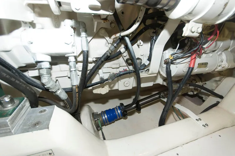 Slide: The Image of Engine compartment of a 2001 Neptunus 56 Express yacht, showing mechanical components and wiring. - 41