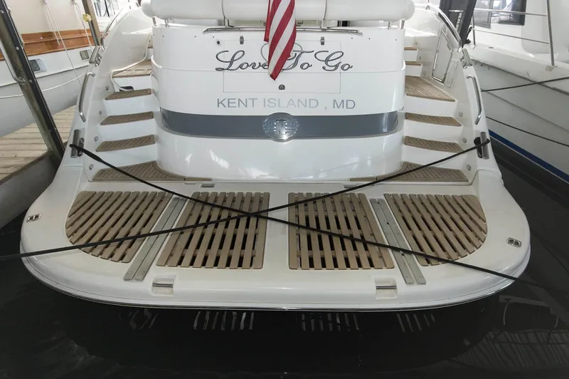Slide: The Image of 2001 Neptunus 56 Express yacht docked at Kent Island, MD, with "Love To Go" nameplate. - 9