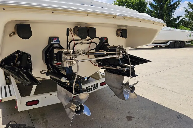 Slide: The Image of 2001 Wellcraft 33 Scarab AVS boat with dual Mercury outboard engines and propellers. - 31