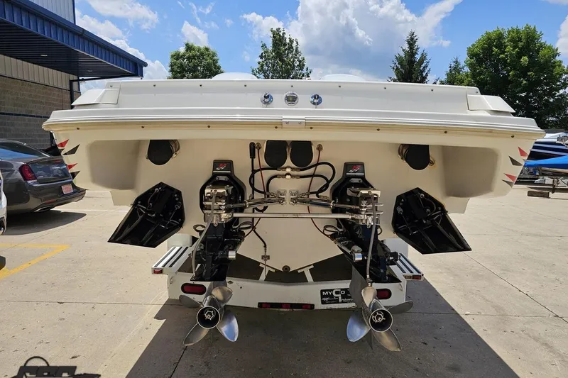 Slide: The Image of Rear view of a 2001 Wellcraft 33 Scarab AVS boat with dual propellers. - 32