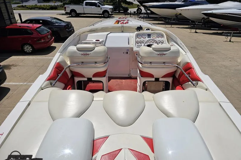 Slide: The Image of 2001 Wellcraft 33 Scarab AVS boat interior with white and red seating, dashboard view. - 43
