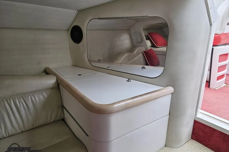 Slide: The Image of Interior cabin of 2001 Wellcraft 33 Scarab AVS with seating and storage. - 79