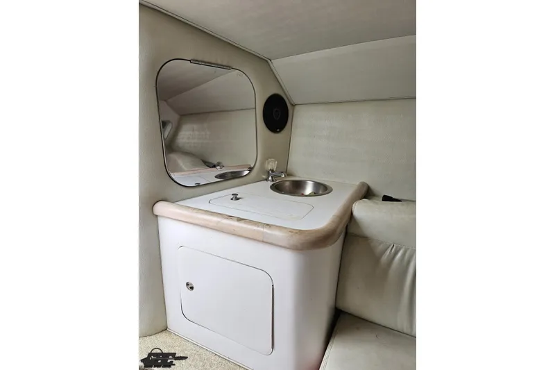 Slide: The Image of 2001 Wellcraft 33 Scarab AVS interior with sink and mirror in cabin. - 82