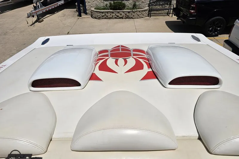 Slide: The Image of 2001 Wellcraft 33 Scarab AVS boat with custom red and white engine cover design. - 90
