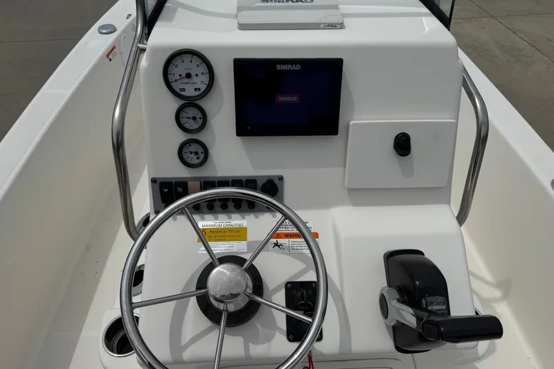 Slide: The Image of 2016 Sea Born SV19 Bay boat console with steering wheel and gauges. - 15