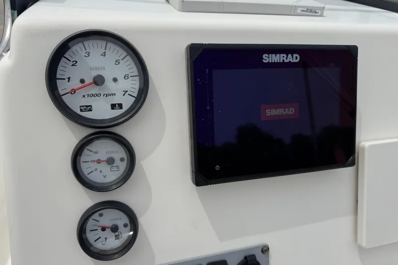 Slide: The Image of Dashboard of 2016 Sea Born SV19 Bay with Simrad display and Yamaha gauges. - 16