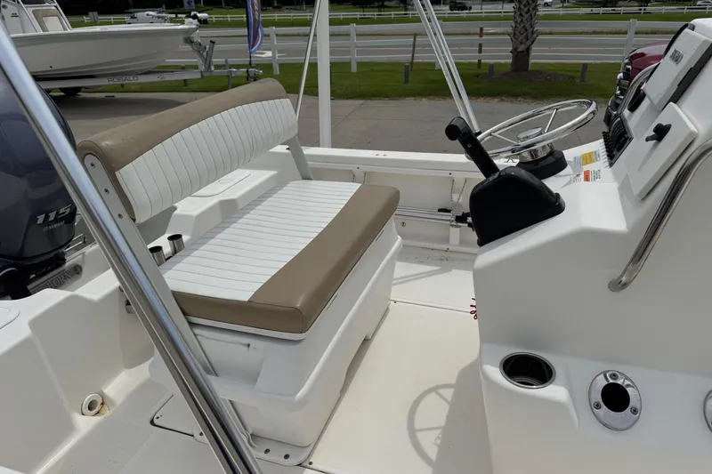 Slide: The Image of 2016 Sea Born SV19 Bay boat interior with steering console and seating. - 9