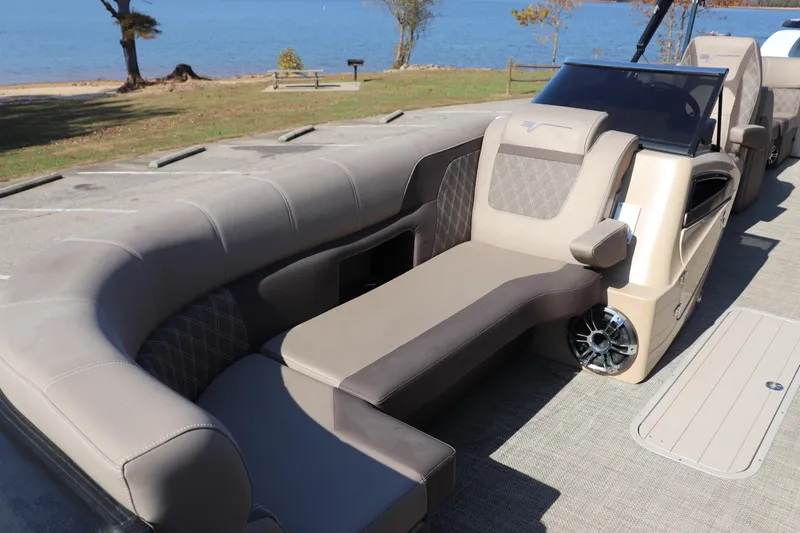 Slide: The Image of Luxurious seating on 2023 Vanderbilt 700 Twin boat by the lake. - 2