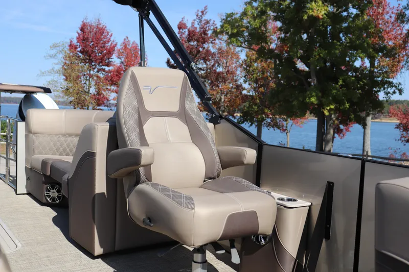 Slide: The Image of Luxurious seating on 2023 Vanderbilt 700 Twin boat with scenic lake view. - 4