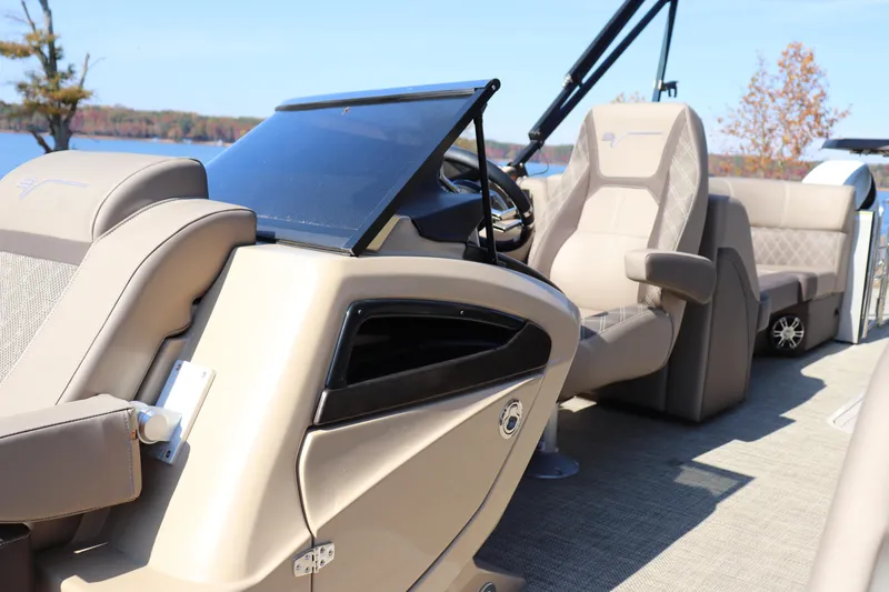 Slide: The Image of 2023 Vanderbilt 700 Twin boat interior with luxurious seating and modern dashboard design. - 6