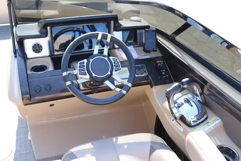 Slide: The Image of Cockpit of 2023 Vanderbilt 700 Twin boat with modern steering and controls. - 8
