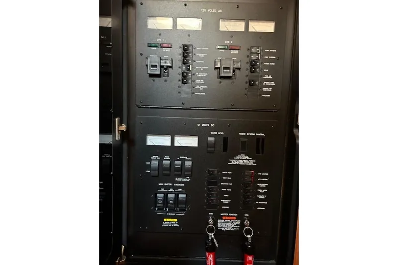 Slide: The Image of Electrical control panel on a 2005 Sea Ray 390 Sundancer boat. - 10