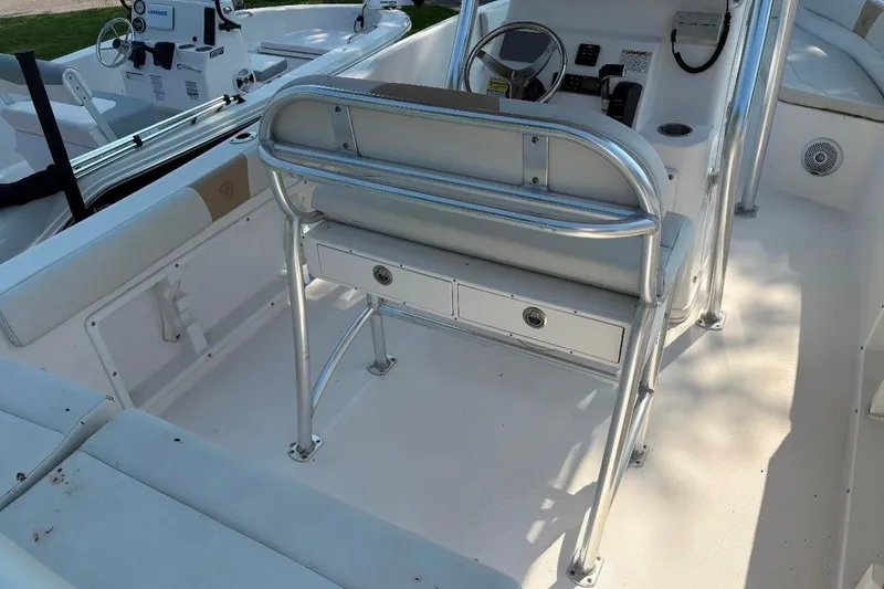Slide: The Image of 2017 Century 2200 Center Console boat interior with steering and seating area. - 11