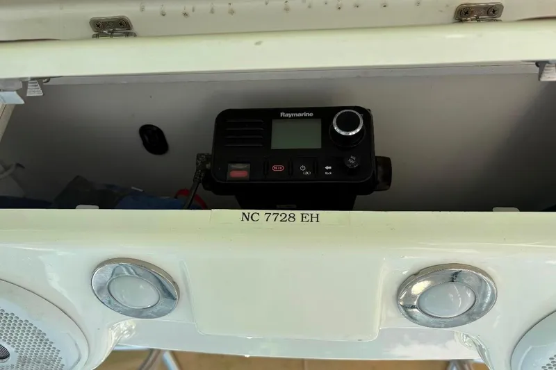 Slide: The Image of 2017 Century 2200 Center Console with Raymarine device and NC 7728 EH registration. - 16