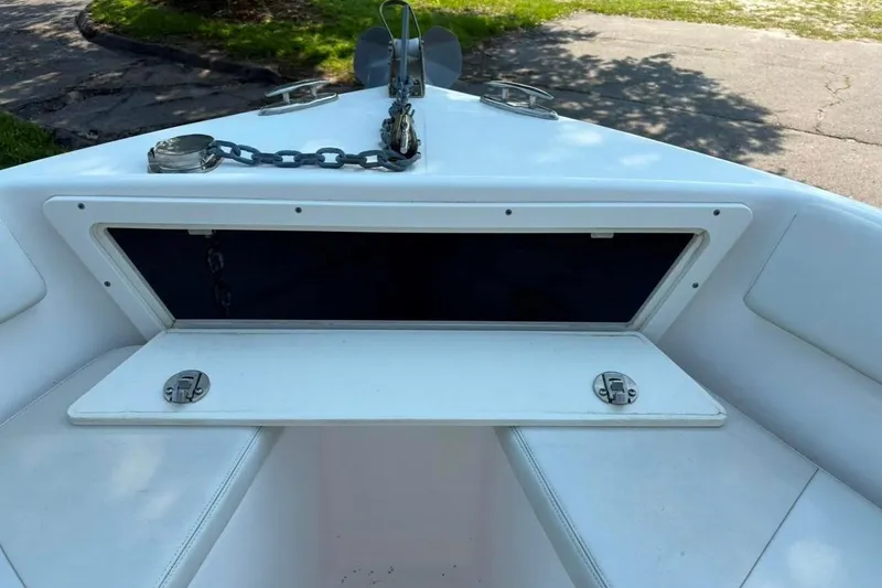 Slide: The Image of 2017 Century 2200 Center Console boat anchor storage compartment open. - 5