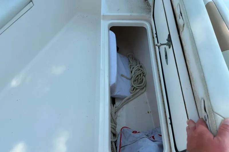 Slide: The Image of Storage compartment on a 2017 Century 2200 Center Console boat with rope inside. - 8