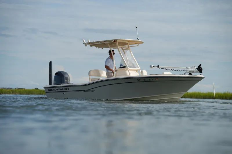 Slide: The Image of 2018 Grady-White 191 Coastal Explorer boat on calm water, side view. - 11