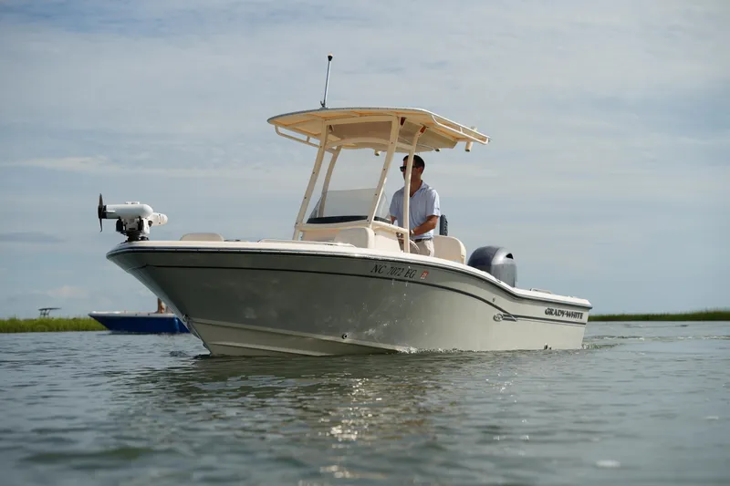 Slide: The Image of 2018 Grady-White 191 Coastal Explorer boat cruising on calm waters. - 15