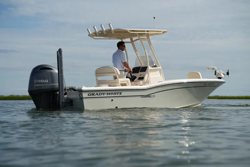 Slide: The Image of 2018 Grady-White 191 Coastal Explorer boat on water, featuring Yamaha engine. - 18