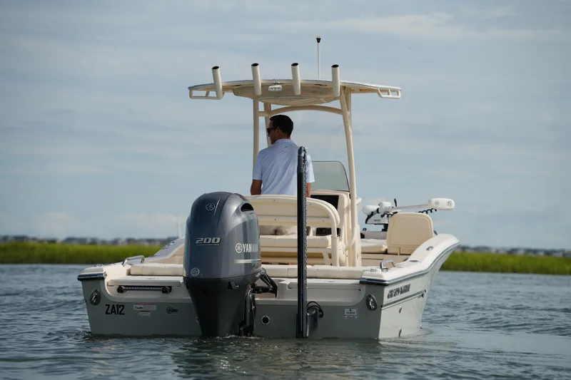Slide: The Image of 2018 Grady-White 191 Coastal Explorer boat on water, rear view with Yamaha engine. - 19