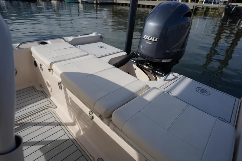 Slide: The Image of 2018 Grady-White 191 Coastal Explorer boat with Yamaha 200 engine, docked by the water. - 23