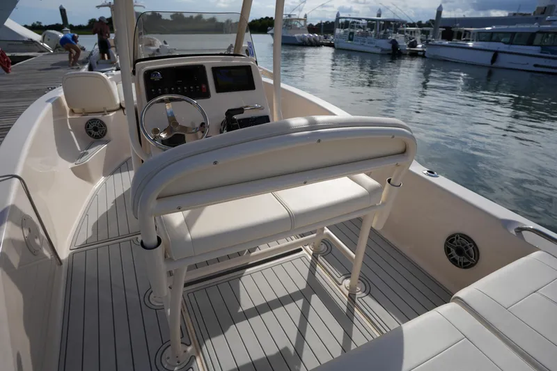 Slide: The Image of 2018 Grady-White 191 Coastal Explorer boat interior with helm and seating. - 25