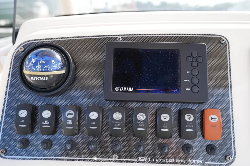 Slide: The Image of Control panel of 2018 Grady-White 191 Coastal Explorer boat with compass and Yamaha display. - 30