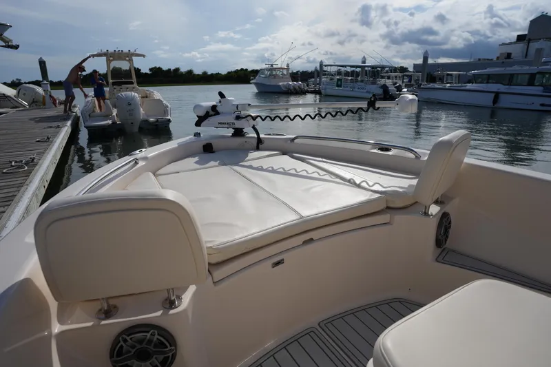 Slide: The Image of 2018 Grady-White 191 Coastal Explorer boat docked at marina, featuring spacious seating. - 37