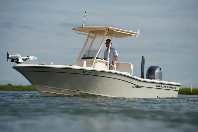 Slide: The Image of 2018 Grady-White 191 Coastal Explorer boat on water, side view. - 4