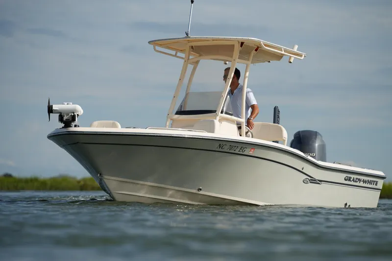 Slide: The Image of 2018 Grady-White 191 Coastal Explorer boat on water, side view. - 5