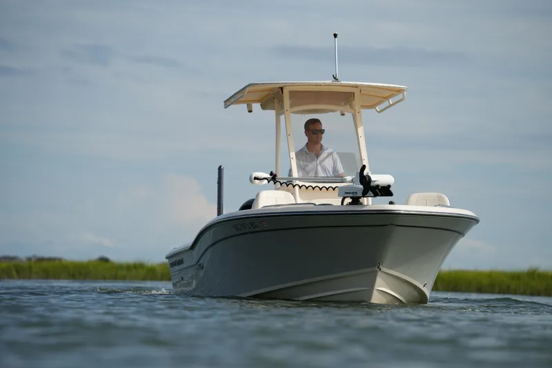 Slide: The Image of 2018 Grady-White 191 Coastal Explorer boat cruising on calm waters. - 8