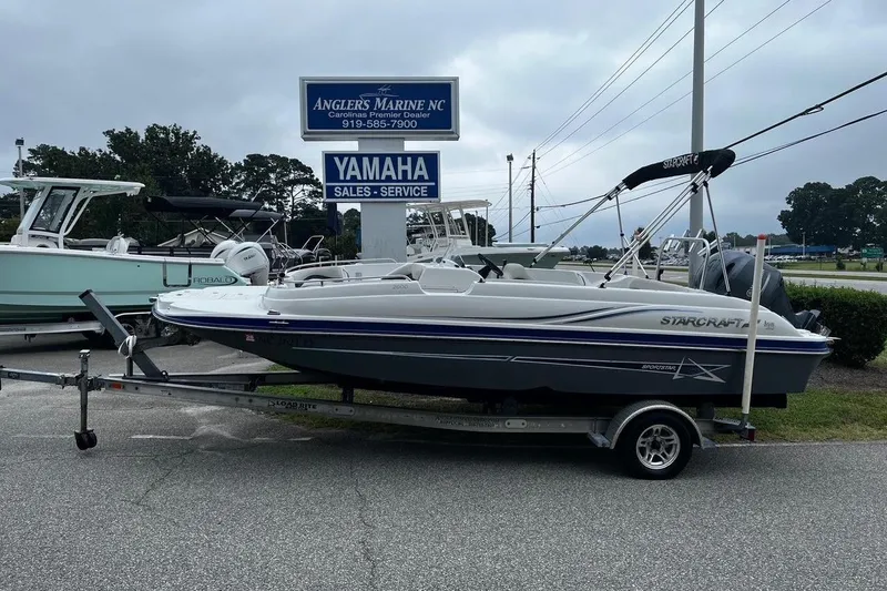 The Image of 2017 Starcraft Limited 2000 OB boat on trailer at Anglers Marine dealership. - 1