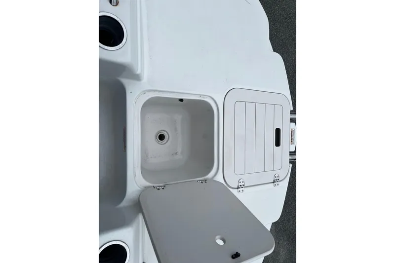 Slide: The Image of 2017 Starcraft Limited 2000 OB boat storage compartment with open lid. - 16