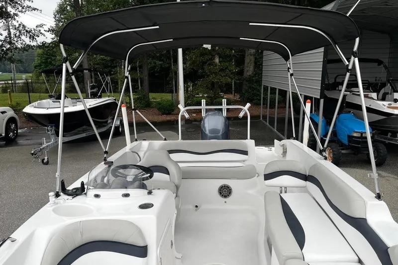 Slide: The Image of 2017 Starcraft Limited 2000 OB boat with canopy, parked outdoors. - 22