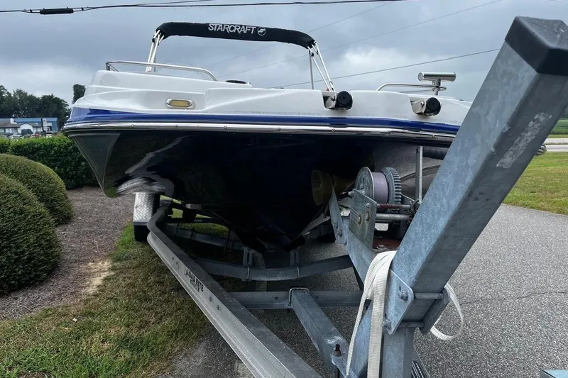 Slide: The Image of 2017 Starcraft Limited 2000 OB boat on trailer, parked outdoors. - 6