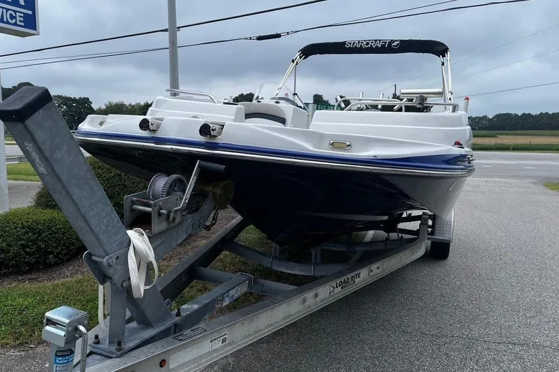 Slide: The Image of 2017 Starcraft Limited 2000 OB boat on trailer, parked outdoors. - 7
