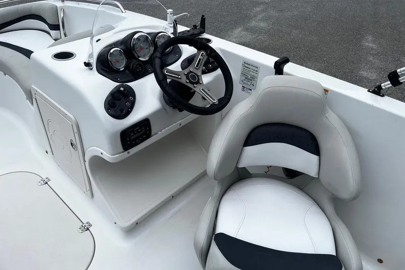 Slide: The Image of 2017 Starcraft Limited 2000 OB boat cockpit with steering wheel and gauges. - 9