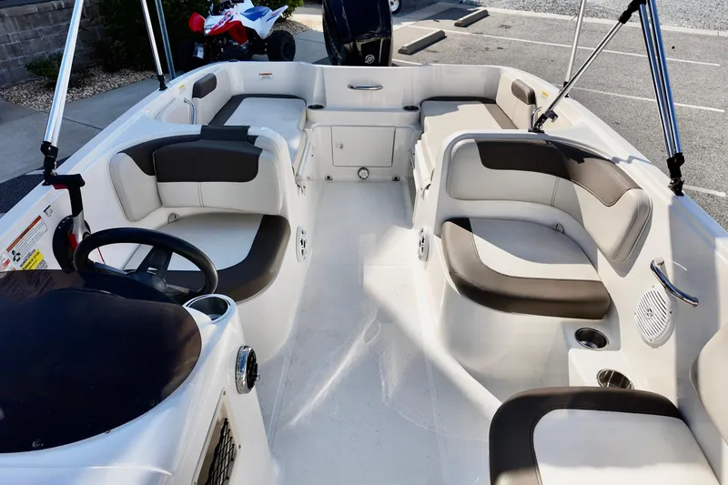 Slide: The Image of 2021 Bayliner Element E18 boat interior with spacious seating and modern design. - 10