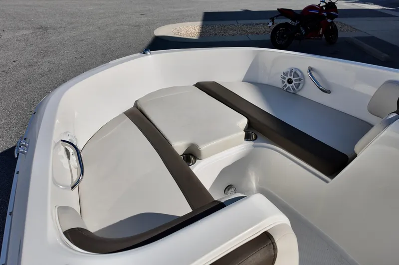 Slide: The Image of 2021 Bayliner Element E18 boat interior with cushioned seating and speaker. - 11