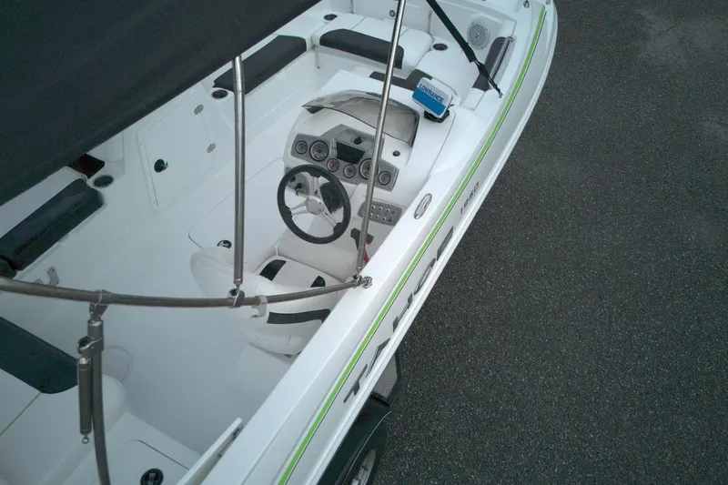 Slide: The Image of Aerial view of 2021 Tahoe 1950 boat interior with steering wheel and seating. - 3
