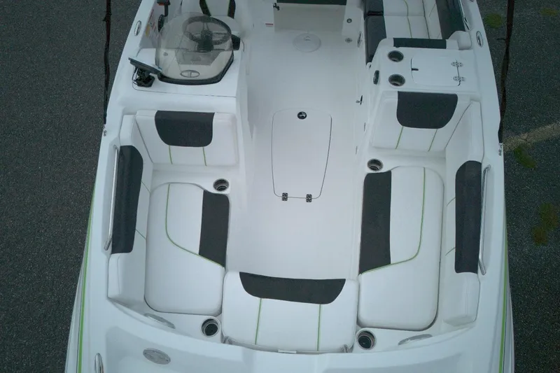 Slide: The Image of Aerial view of 2021 Tahoe 1950 boat interior with white and black seating. - 6