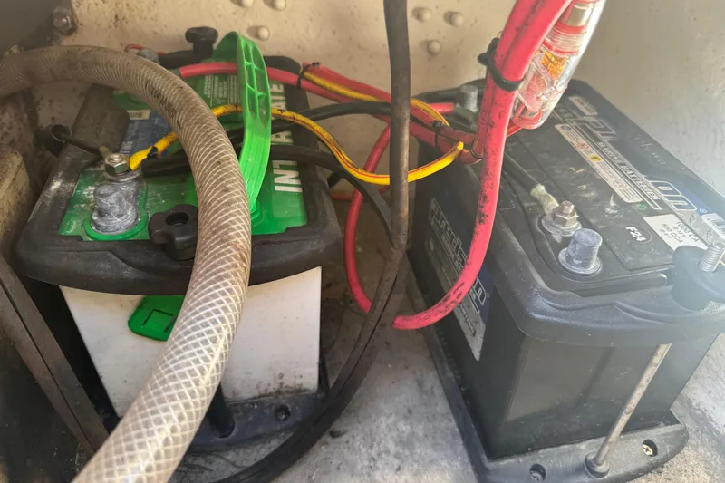Slide: The Image of Batteries and wiring inside a 2014 Carolina Skiff 218 DLV boat. - 11
