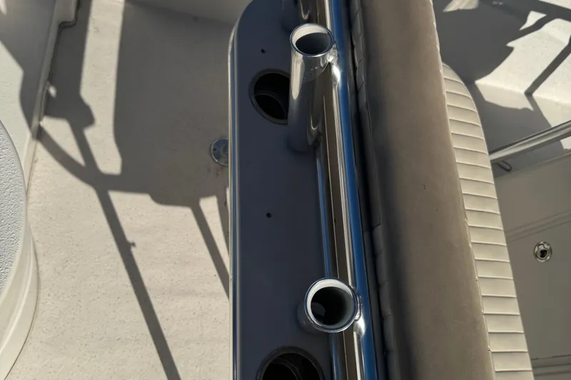 Slide: The Image of 2014 Carolina Skiff 218 DLV boat interior with rod holders and seating. - 12