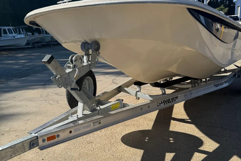 Slide: The Image of 2014 Carolina Skiff 218 DLV boat on Load Rite trailer in sunlight. - 3