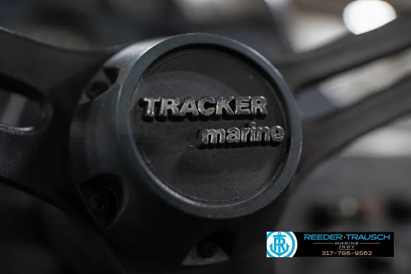 Slide: The Image of 1992 Sun Tracker Party Barge 24 dashboard with steering wheel and gauges. - 27