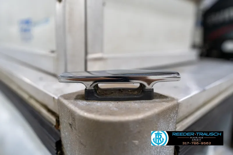 Slide: The Image of Close-up of a rusted metal hook on a 1992 Sun Tracker Party Barge 24. - 46